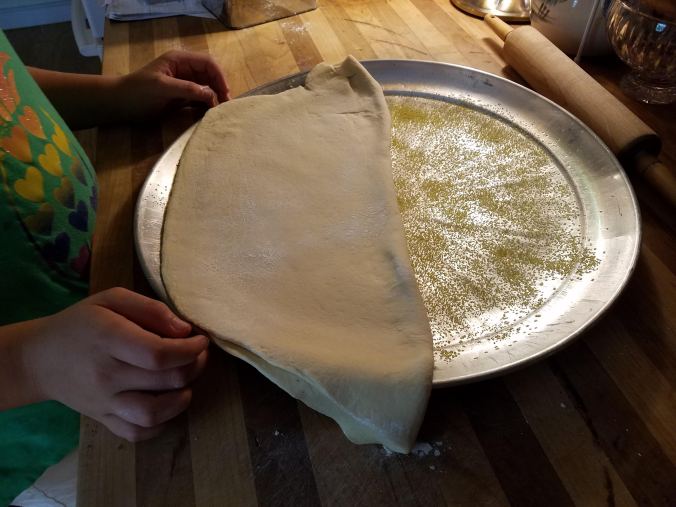 dough on pan in half