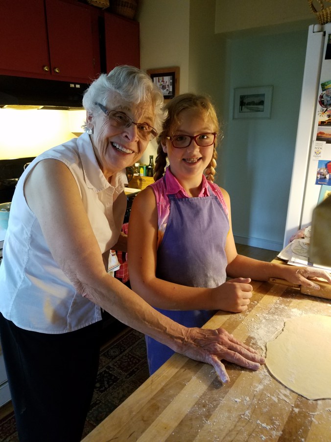 Mom and Kaileena rolling out dough