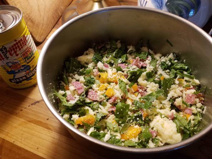 pizza ingredients mixed in bowl