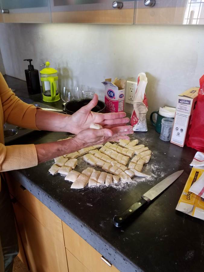 cutting up dough and forming balls